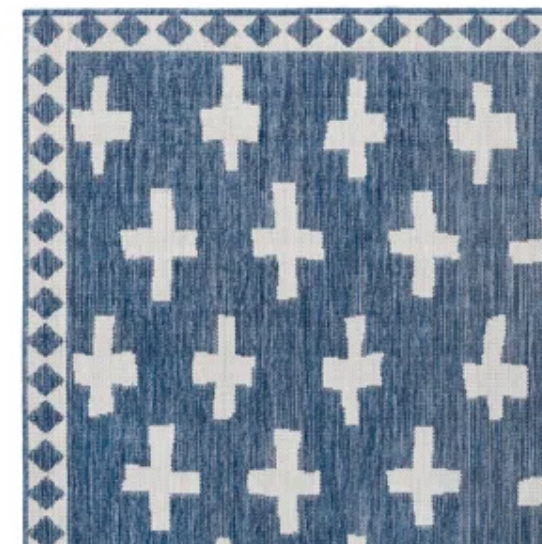 blue and cream patterned rug